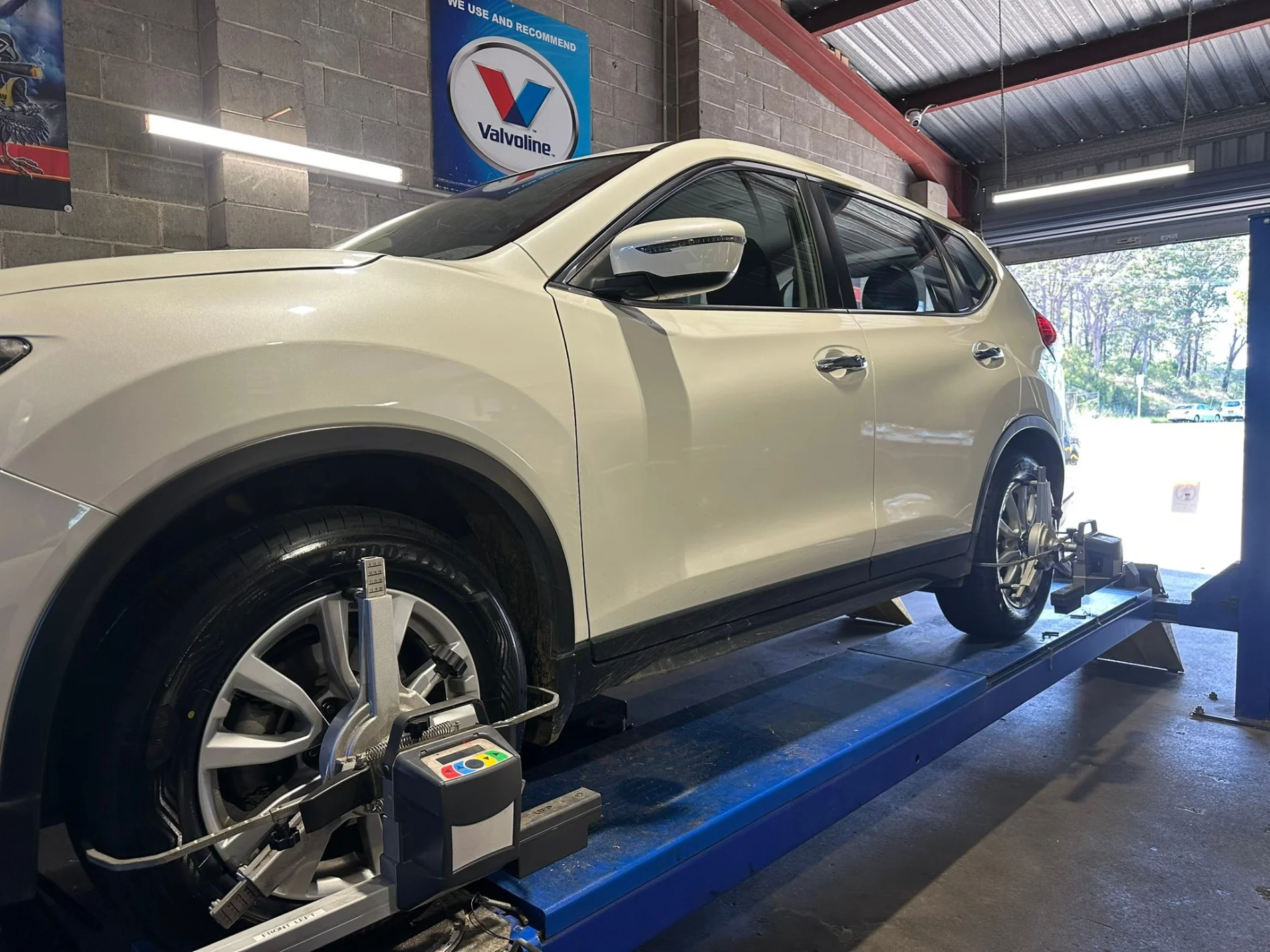 Wheel alignment in progress on a vehicle at Joe's Auto Service Centre in Forster
